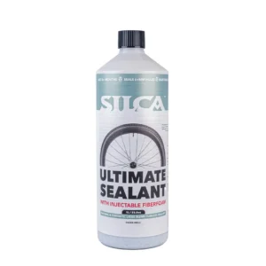 Bottle of Silca Ultimate Sealant for tubeless bicycle tires, showing a wheel on the label and a black cap.